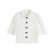 NAVY BOW BUTTON BLOUSE
