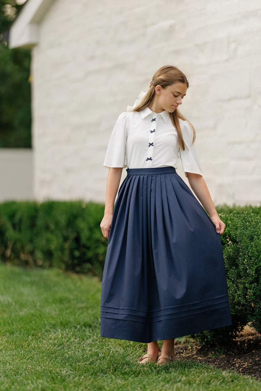 NAVY PLEATED MIDI SKIRT