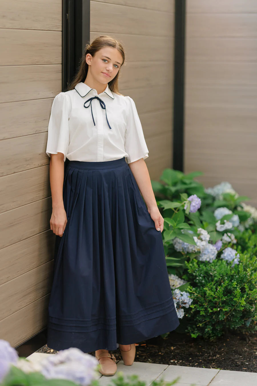 NAVY PLEATED MIDI SKIRT