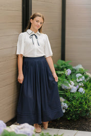 NAVY PLEATED MIDI SKIRT
