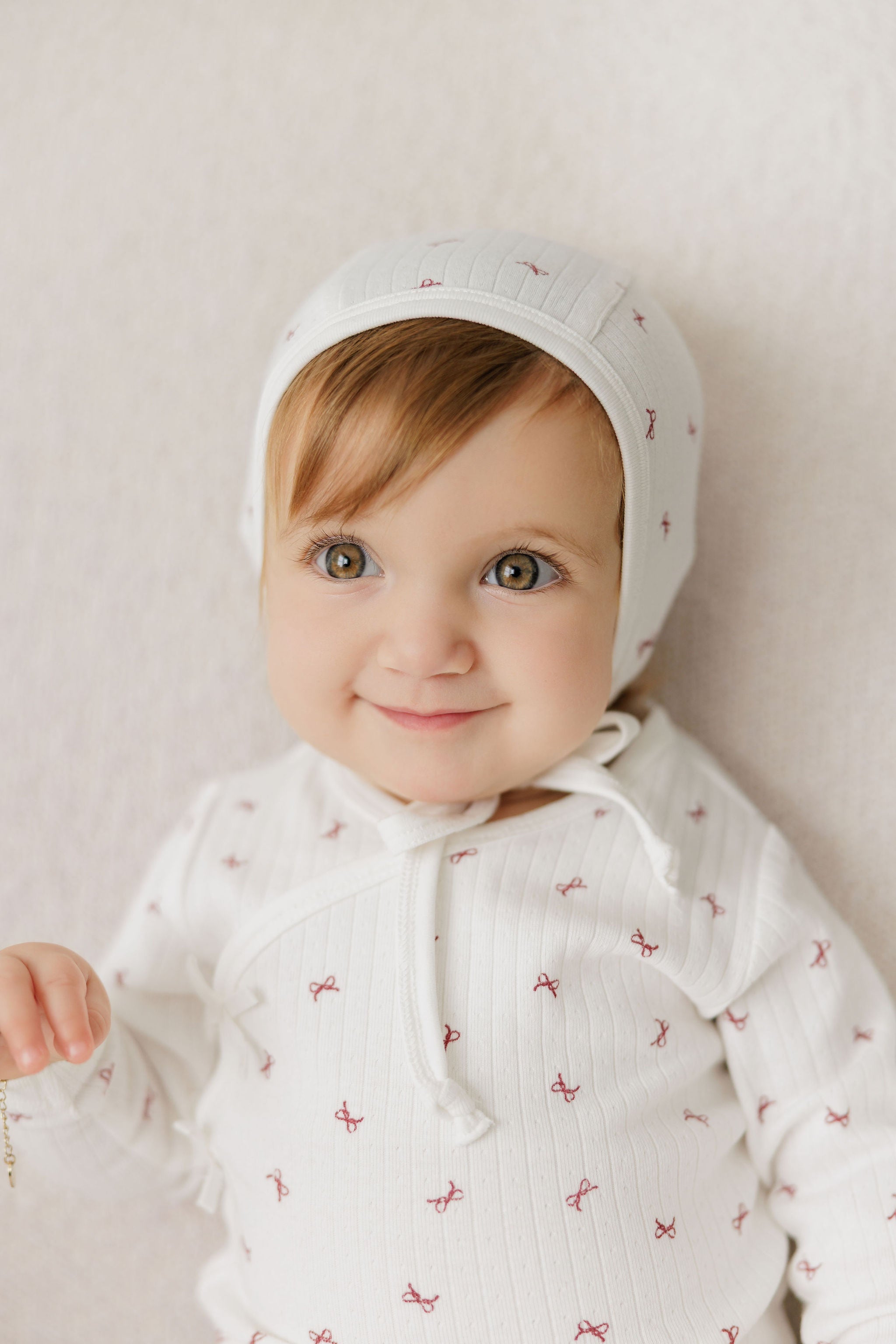 Baby Girl Footie – Ivory Red – Bow Pattern