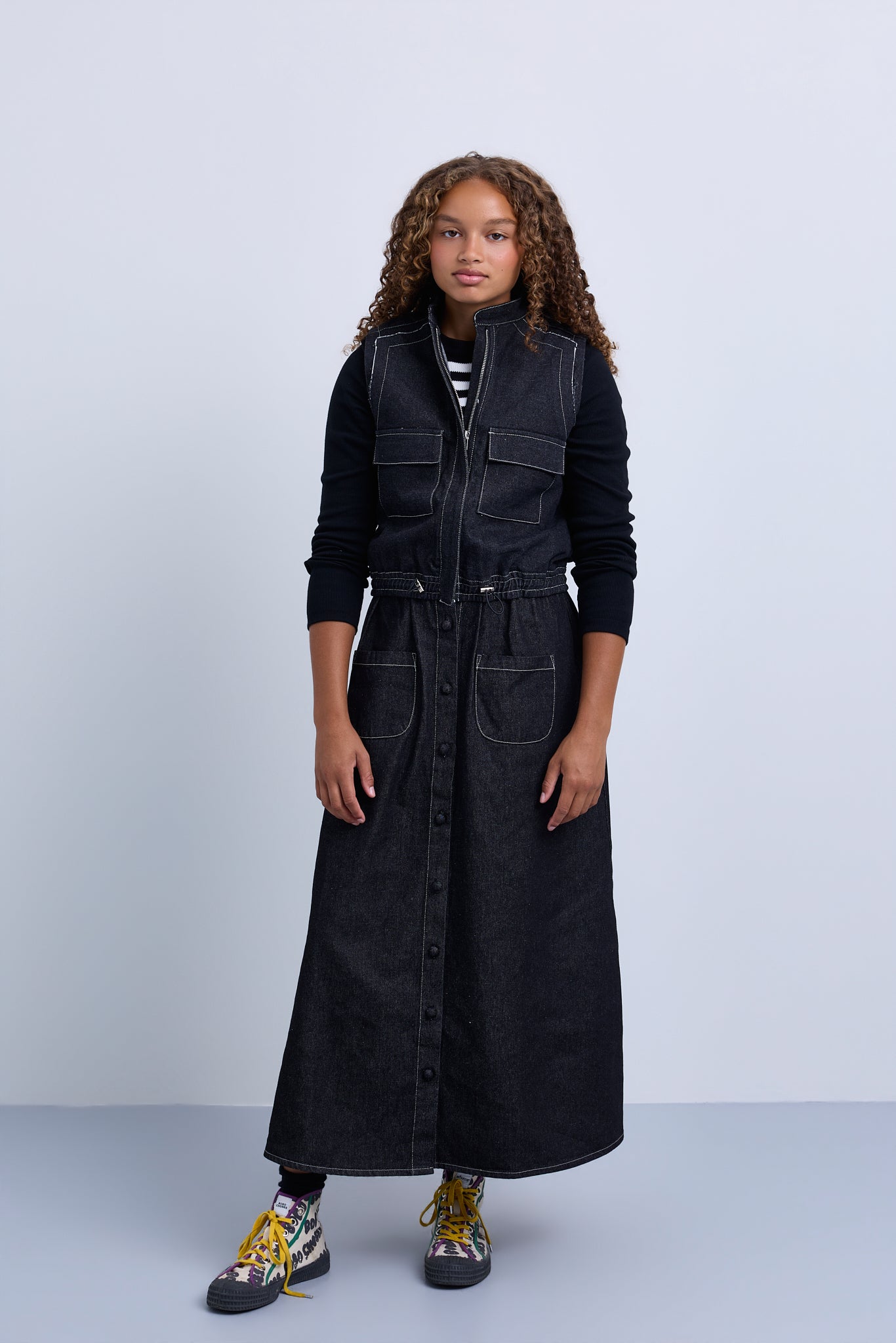 Denim jacket with knitted sleeve