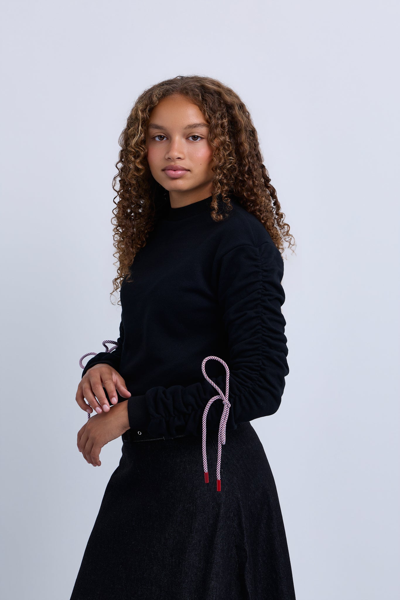 Jersey knit sweater top with tie up sleeve detail