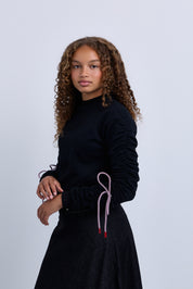 Jersey knit sweater top with tie up sleeve detail