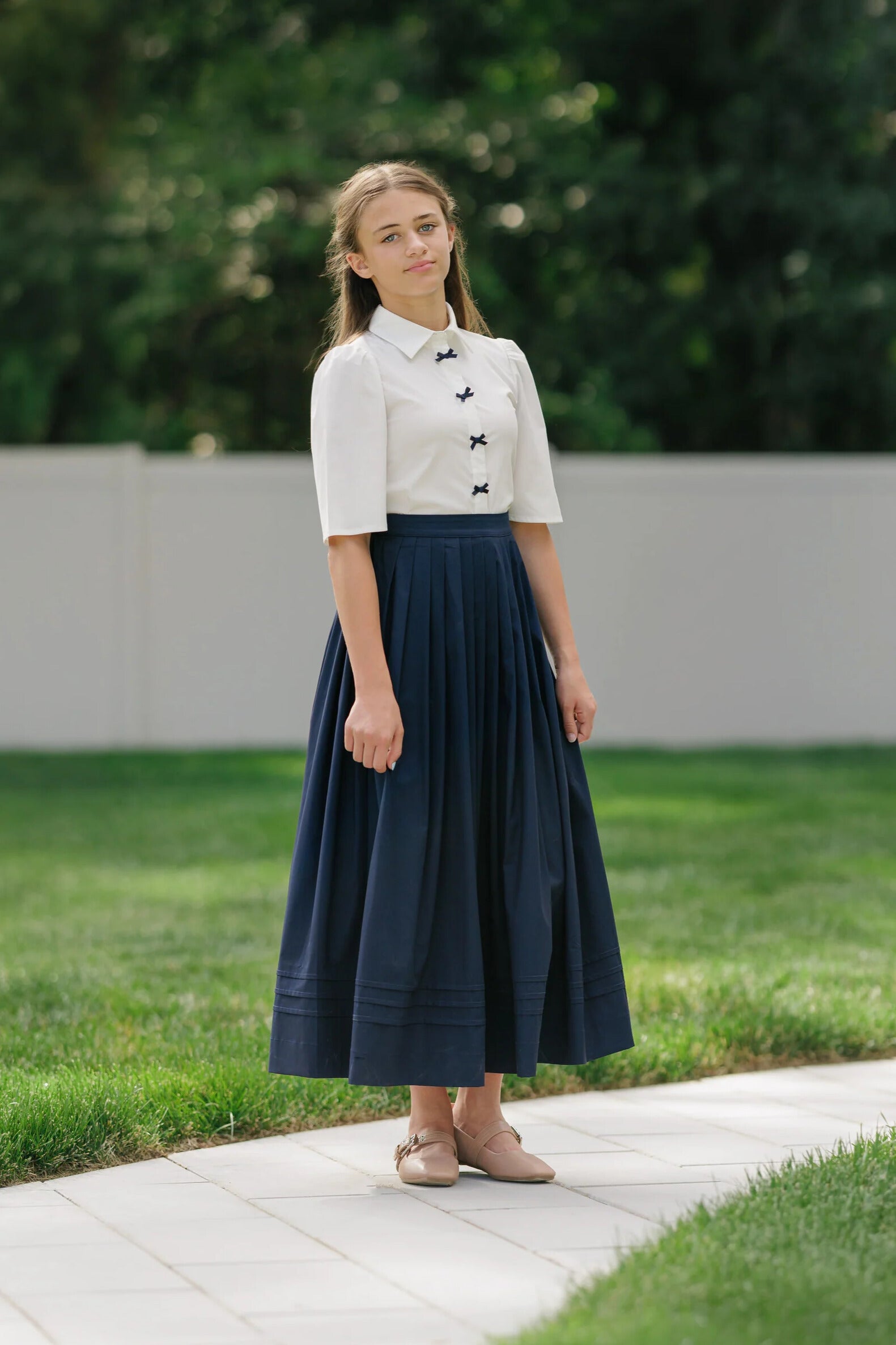 NAVY BOW BUTTON BLOUSE